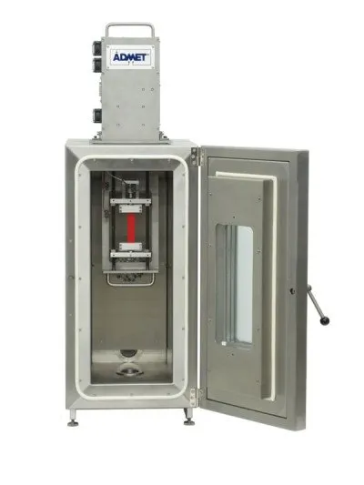 small material testing machine performing a tensile test in an environmental chamber