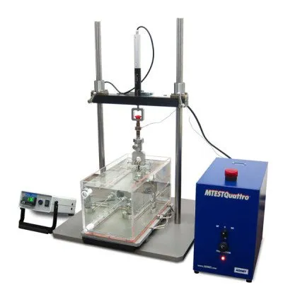 small universal testing machine performing a tensile test in a temperature-controlled saline bath