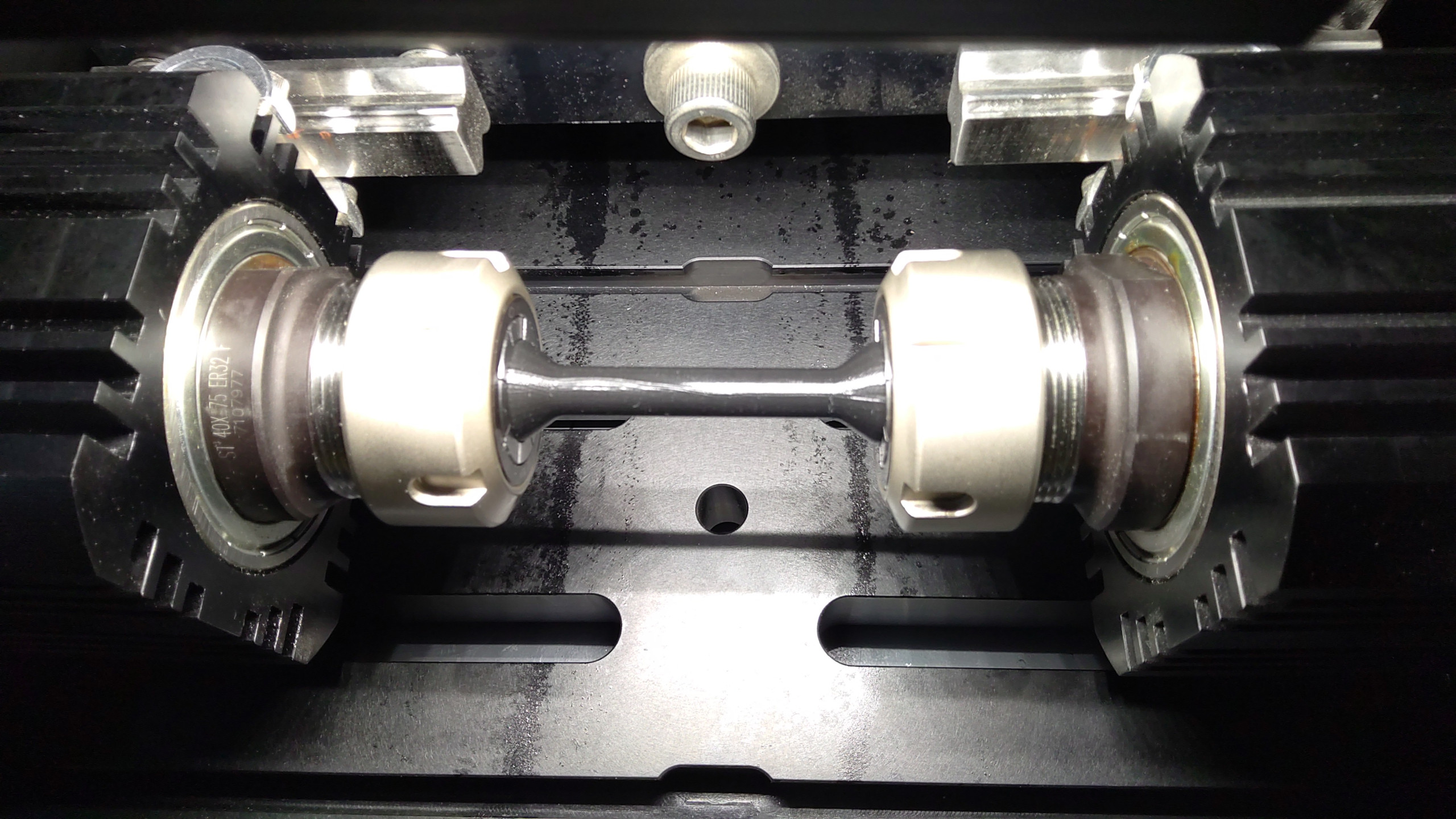 Rotating beam fatigue testing on a polymer sample